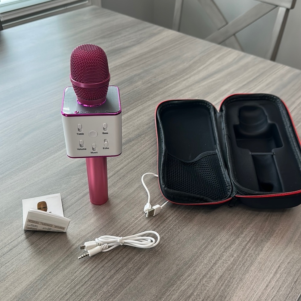 Pink microphone with charging cord